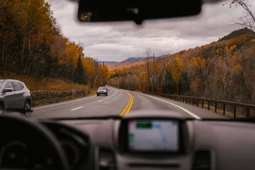 dashboard camera view of road lane at dawn