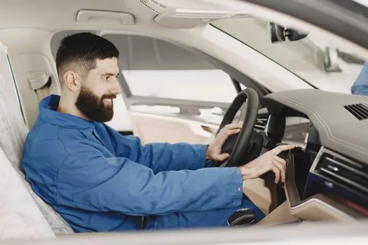 driver checking car insurance on laptop