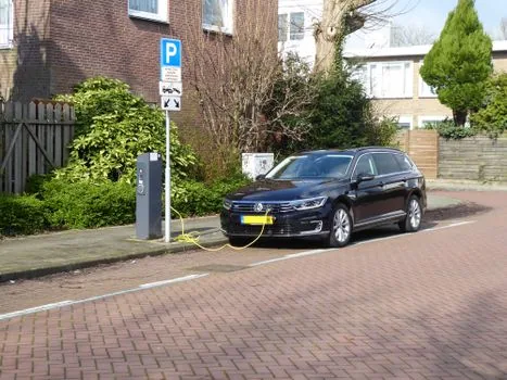 electric car rainy charging station