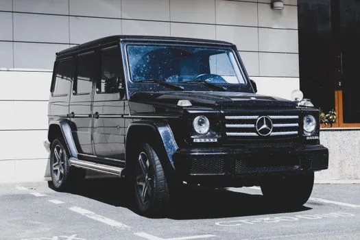luxury black SUV on road