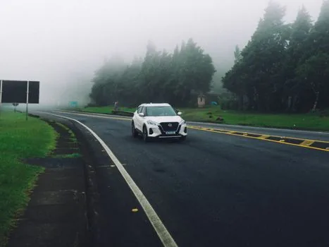 white compact suv on road