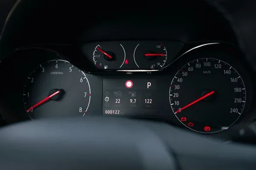 Korean driver documenting dashboard warning lights, dashcam memory card, insurance claim notes and repair history after sudden acceleration suspicion, realistic car interior photo | 급가속 의심 사고 뒤 운전자가 보존할 기록